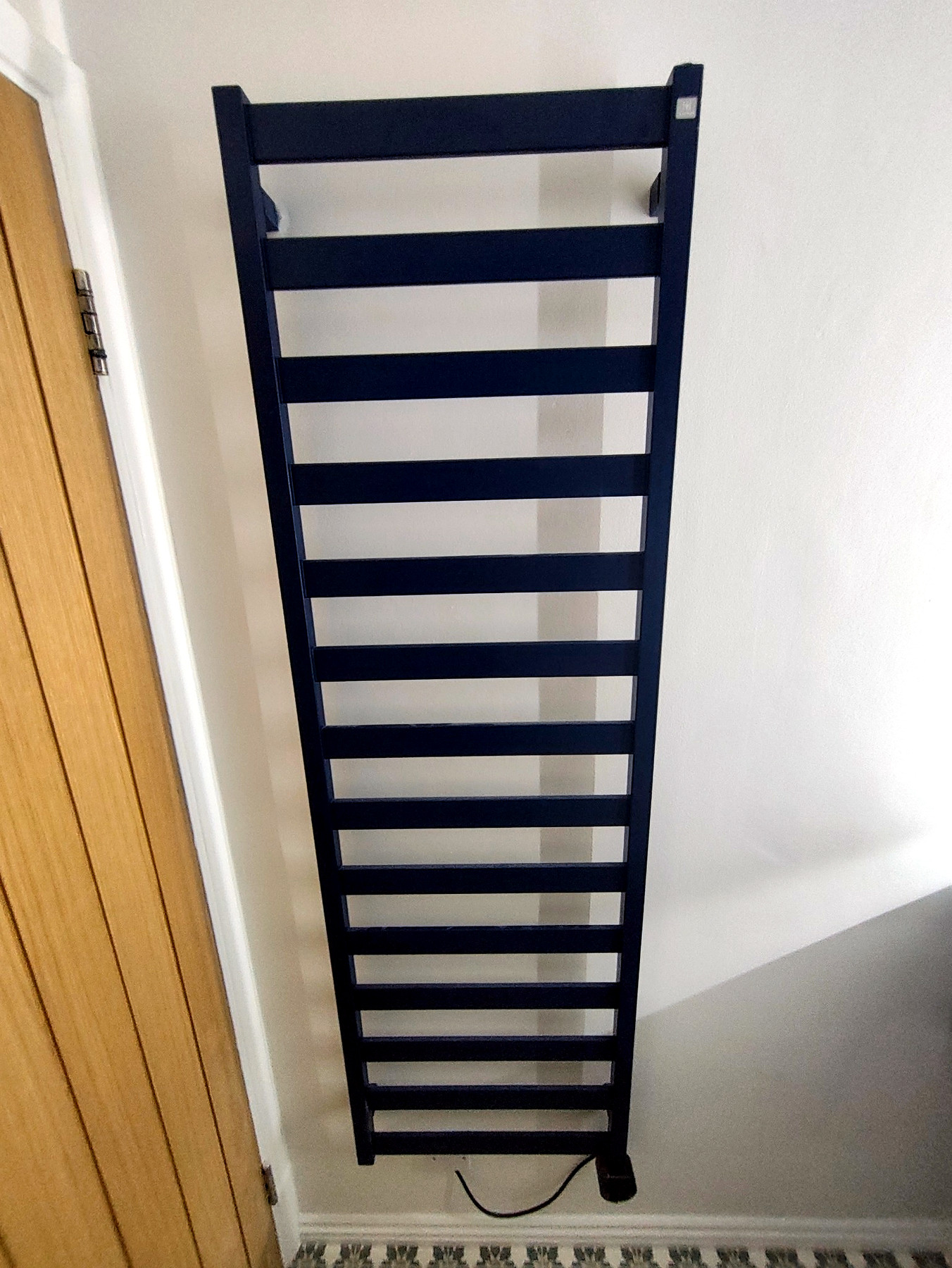 Heated towel radiator fitted in the finished bathroom