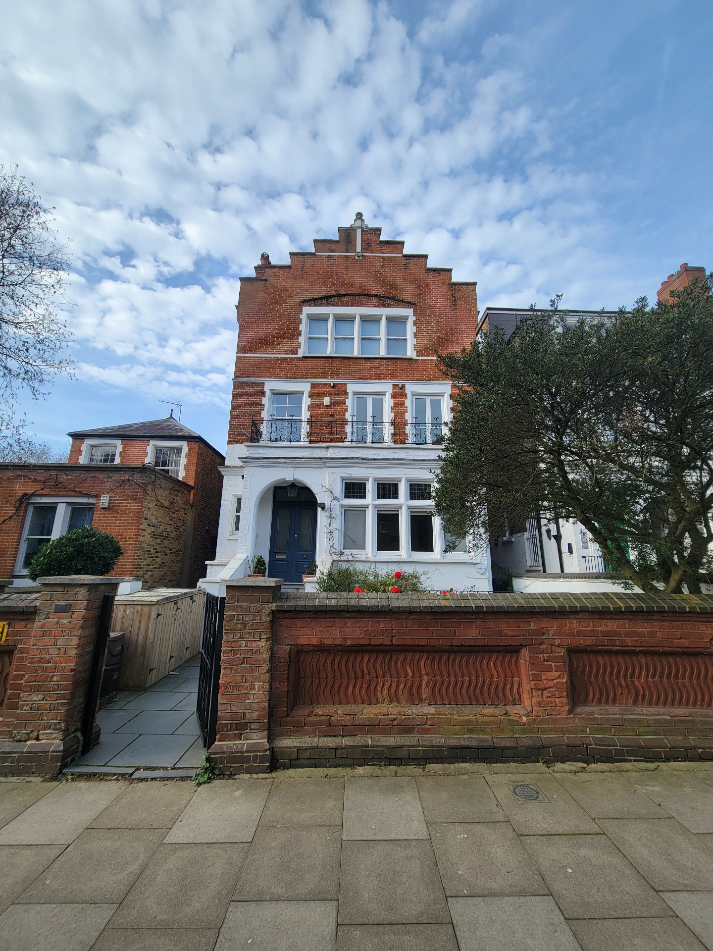 Front of the refurbished red-brick period townhouse in Belsize Park